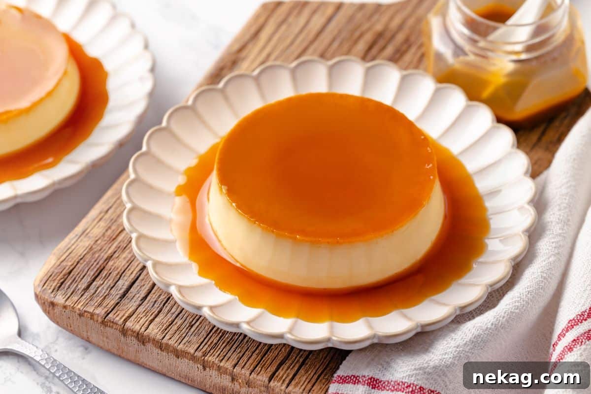 Silky Caramel Custard 4 A beautifully plated creme caramel dessert served with its caramel sauce pooling around it.