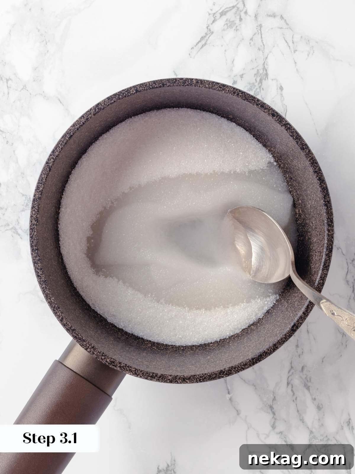 Silky Caramel Custard 5 Sugar melting in a saucepan, gradually turning into caramel for creme caramel.