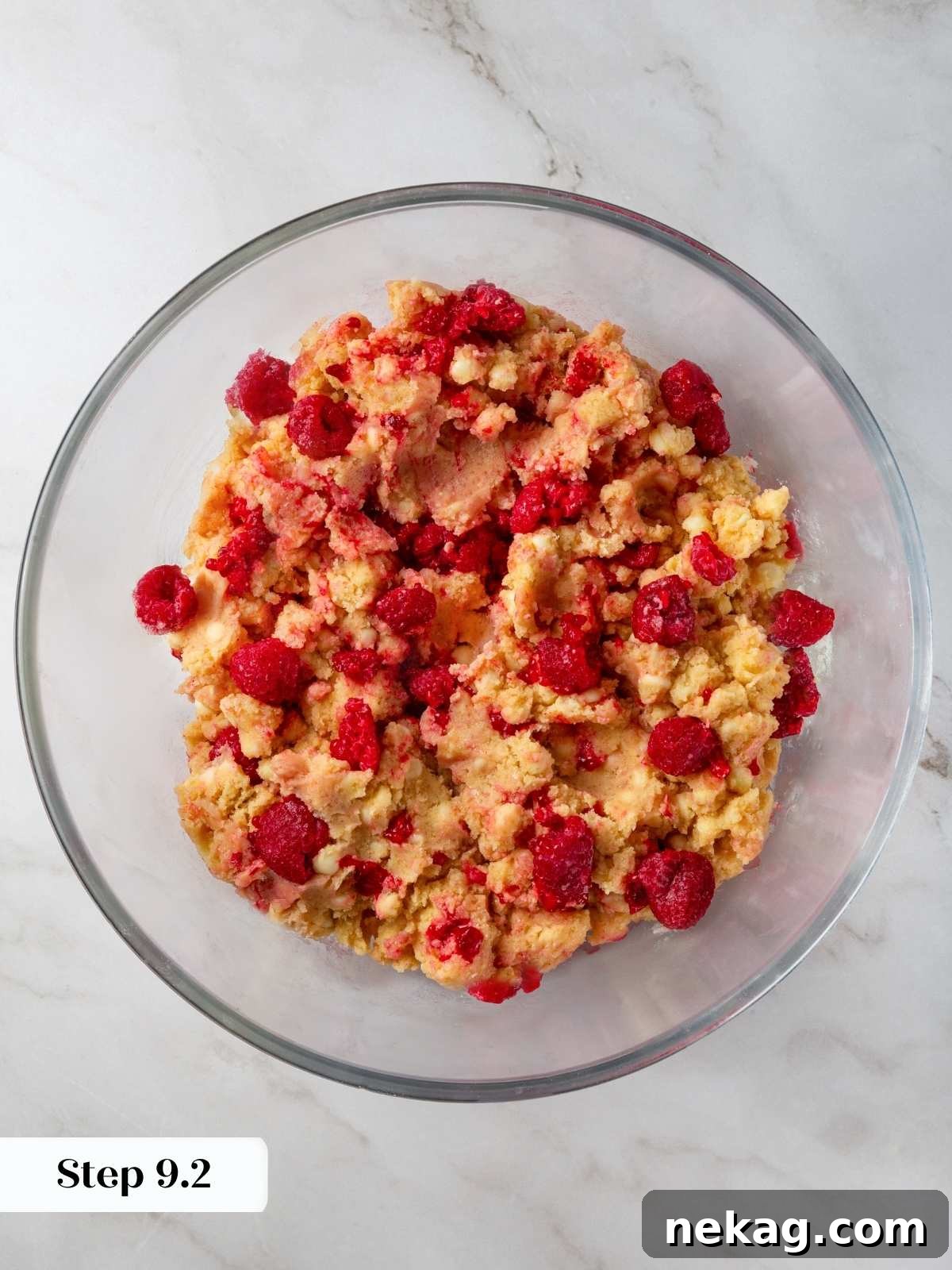 Fresh raspberries gently folded into the cookie dough, creating beautiful streaks of color.