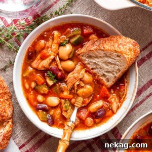 Chicken vegetable soup with tender white beans.