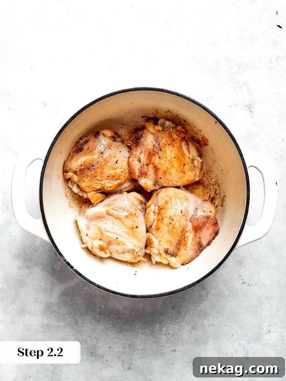 Perfectly browned chicken in a Dutch oven, ready to be removed.