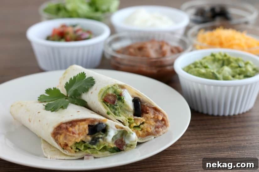 Ultimate Seven-Layer Burrito 5 A delicious Seven Layer Burrito cut in half, showcasing layers