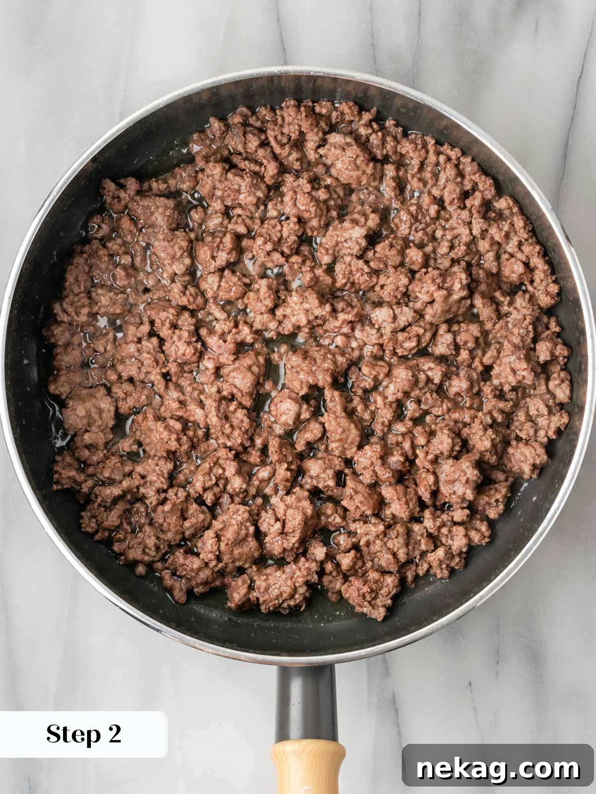 Hearty Meat-Stuffed Pasta Shells 6 Ground beef browning in a saucepan, forming the base for a savory filling.