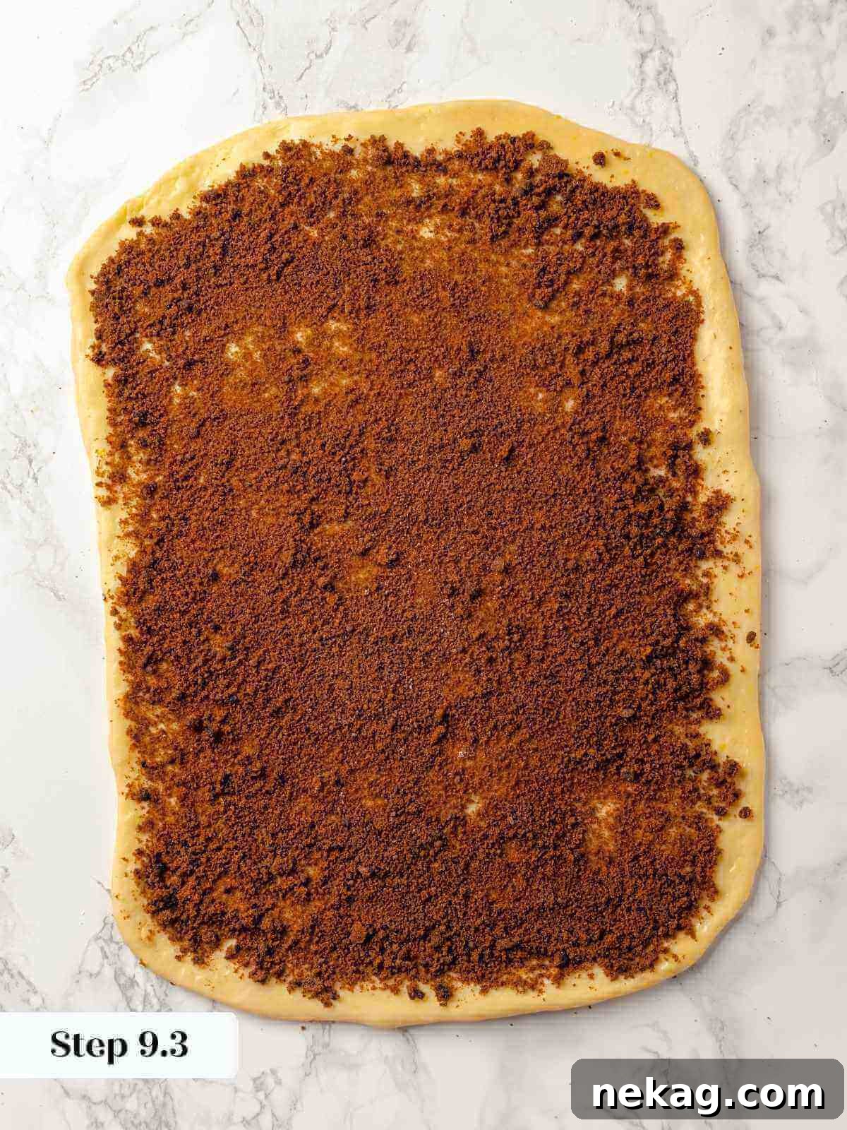 Dough brushed with butter and sprinkled with cinnamon sugar.
