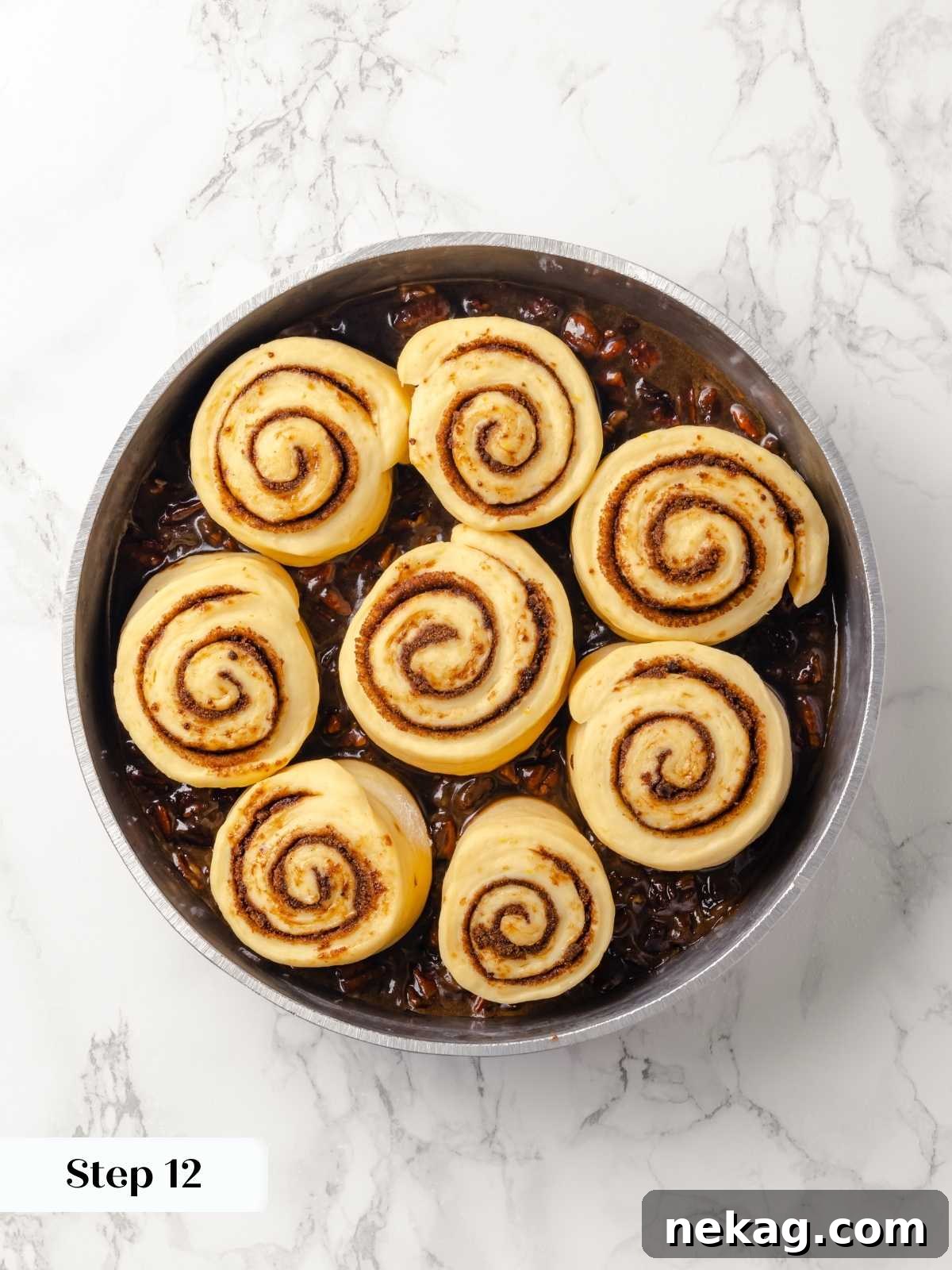 Sticky buns in the pan after proofing, ready to bake.