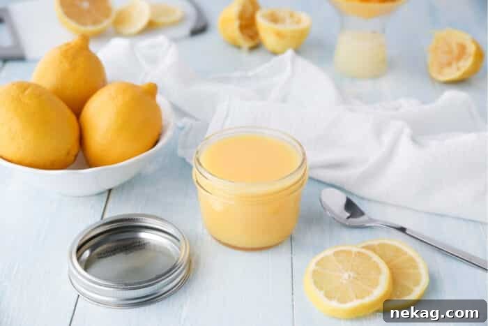 Homemade Lemon Curd Delight 3 Homemade lemon curd elegantly presented in a clear mason jar, highlighting its vibrant yellow hue.