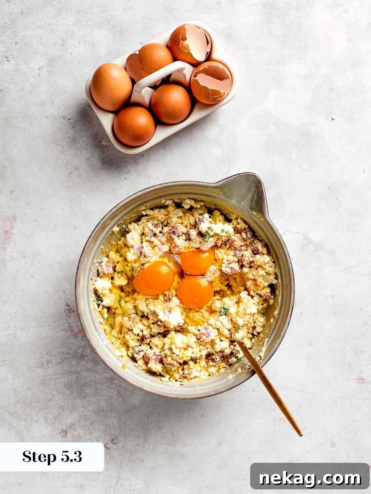 Bright, vibrant egg yolks gracefully blending into the creamy and flavorful filling mixture, marking the final stage of filling preparation.
