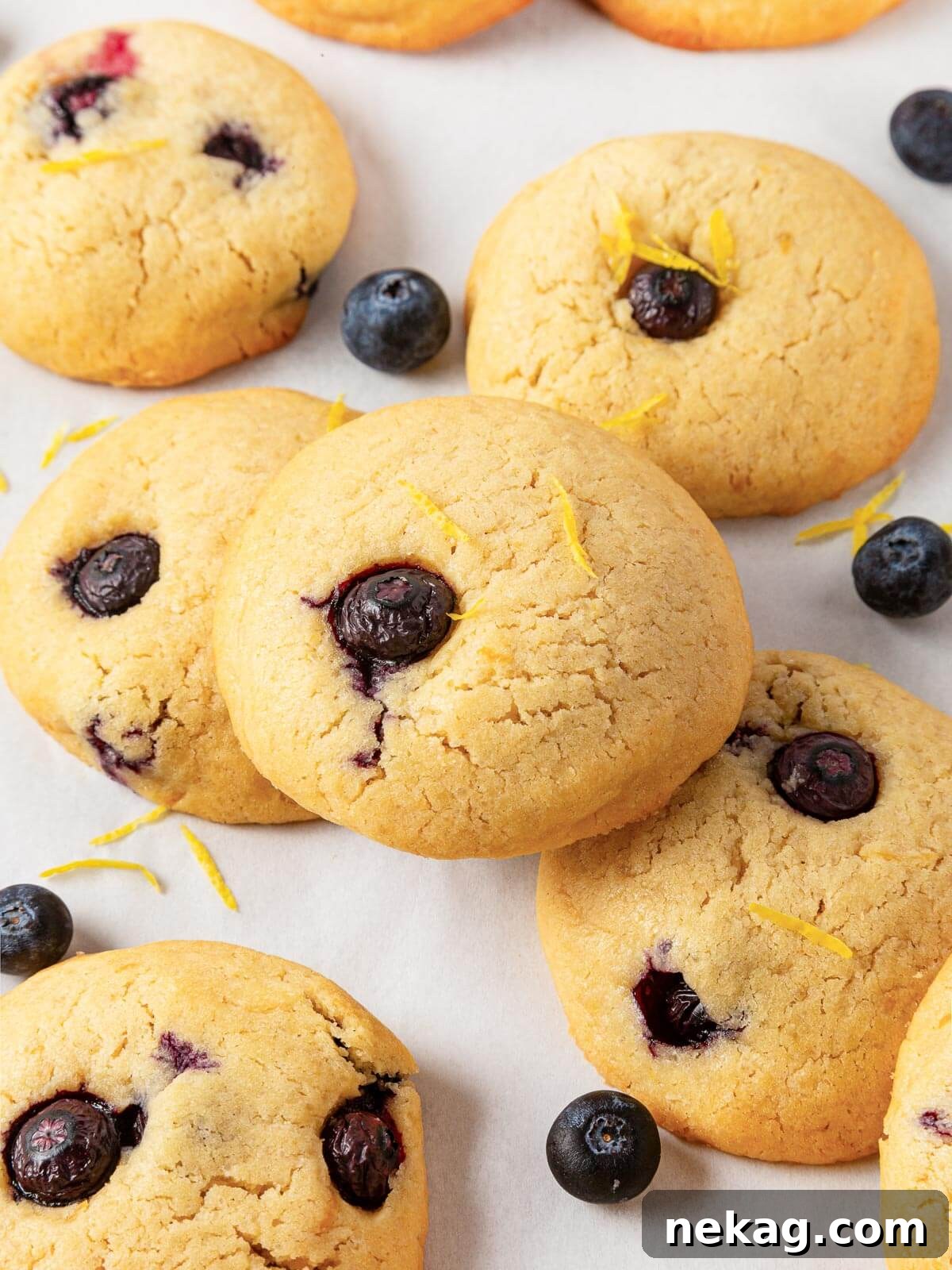 Several lemon blueberry cookies displayed together on a countertop, showcasing their texture.
