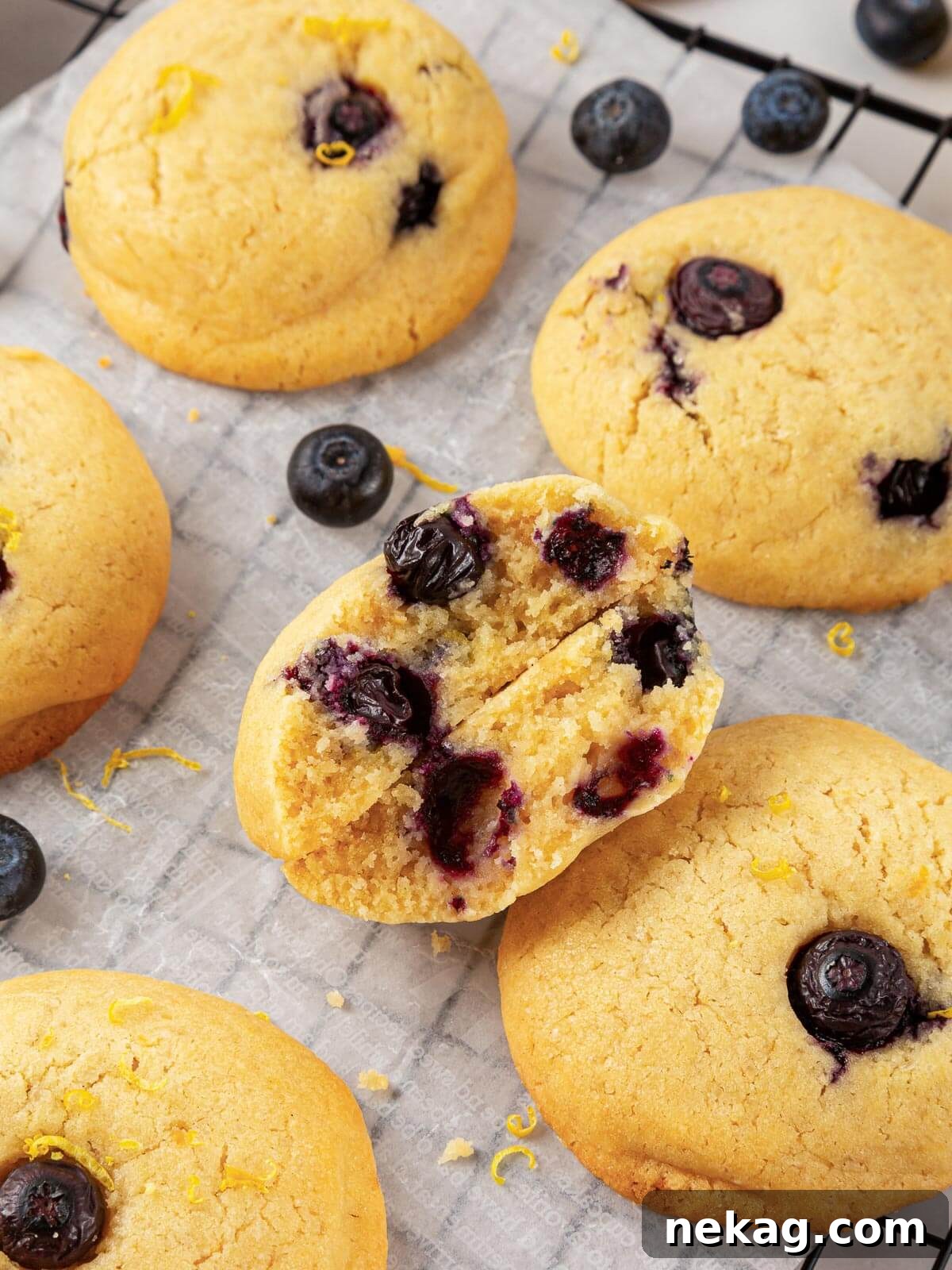 The interior of a chewy lemon blueberry cookie, showcasing the tender crumb and fresh berries embedded within.