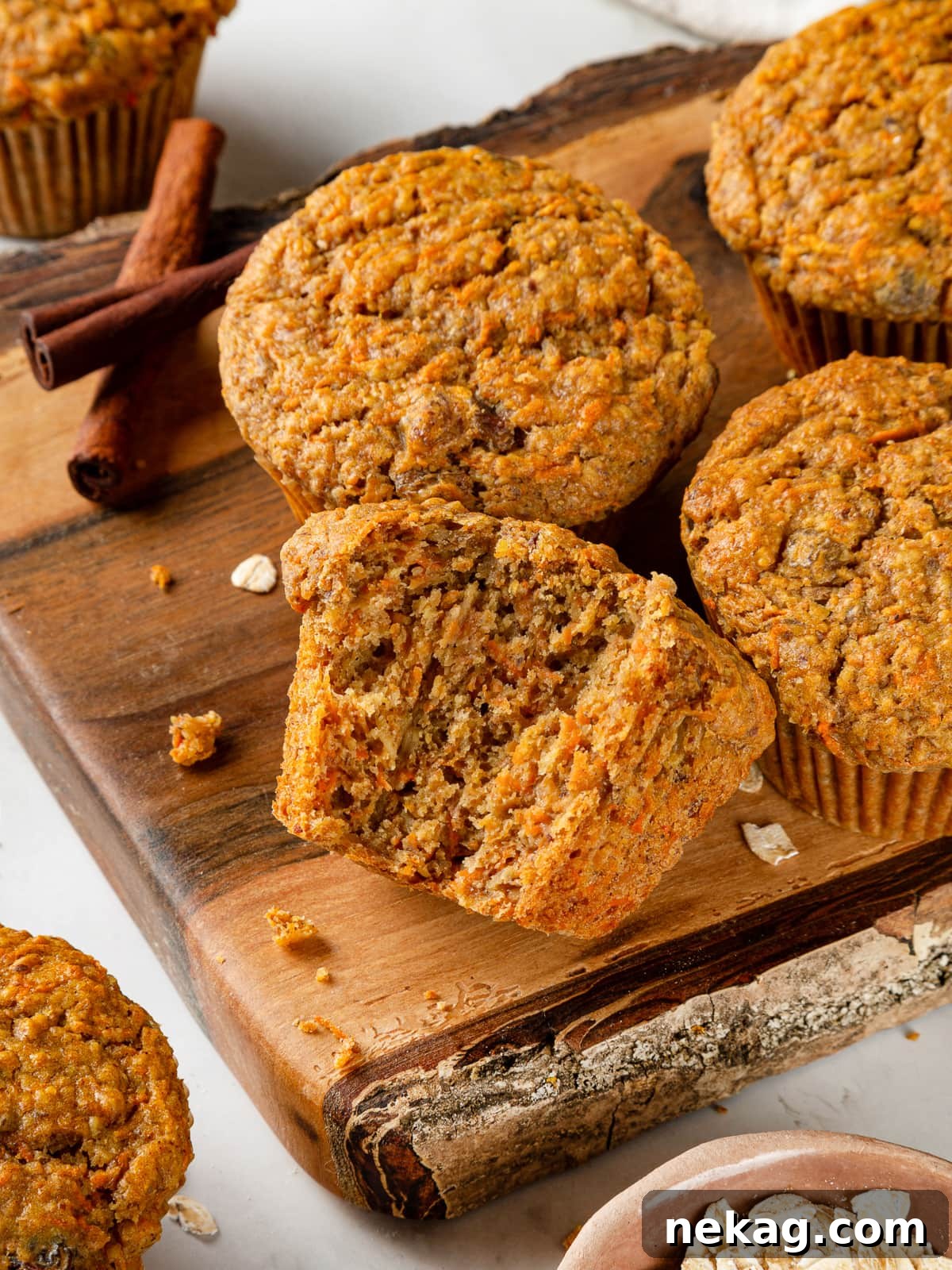 Inside view of a healthy carrot muffin, showcasing its soft, tender crumb, moist texture, and visible shreds of carrot.