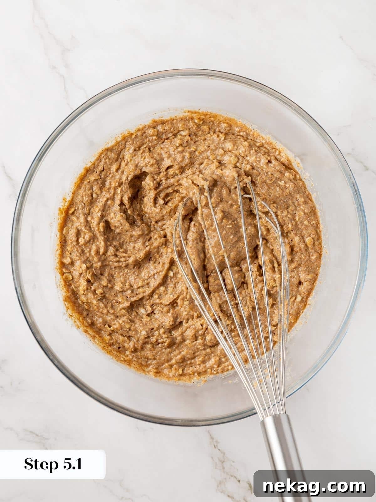 Combining the flour mixture with the wet ingredients in a large mixing bowl, stirring until just moistened.