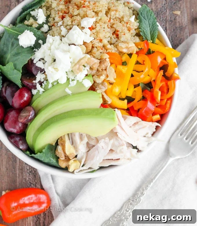 Supercharge Quinoa Kale Bowl 2 Vibrant Quinoa Kale Power Bowl with roasted protein, fresh vegetables, and dressing.