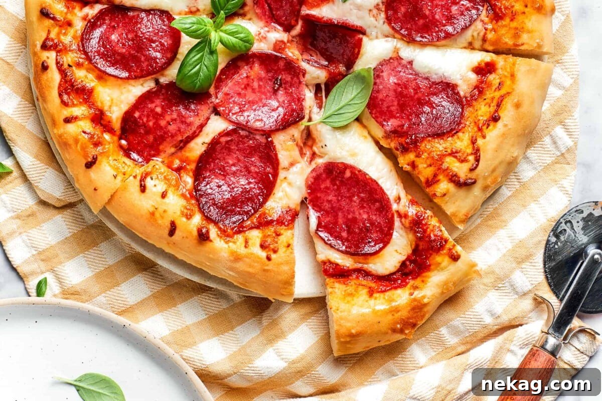 Close-up of a perfectly crisp, golden-brown pizza crust edge, promising a satisfying crunch with every bite.