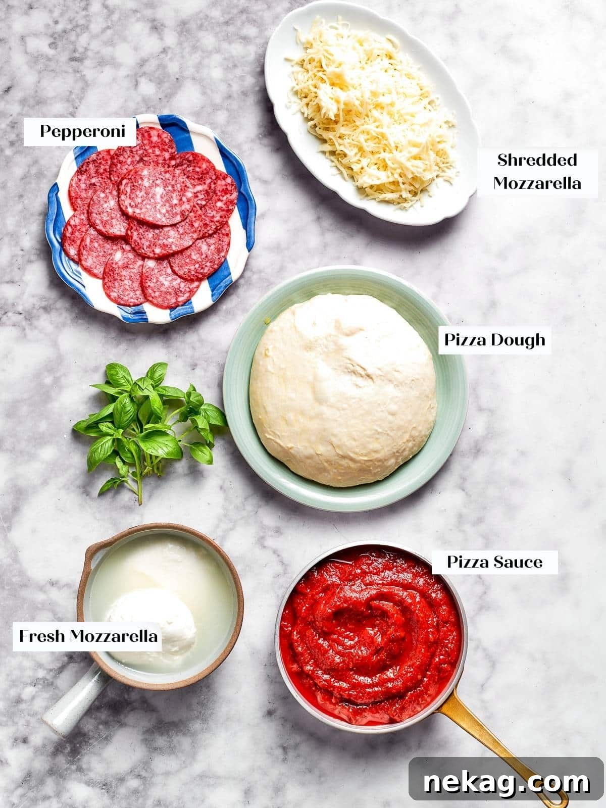 All essential pepperoni pizza ingredients, including dough, sauce, cheese, and pepperoni, neatly displayed on a kitchen counter.