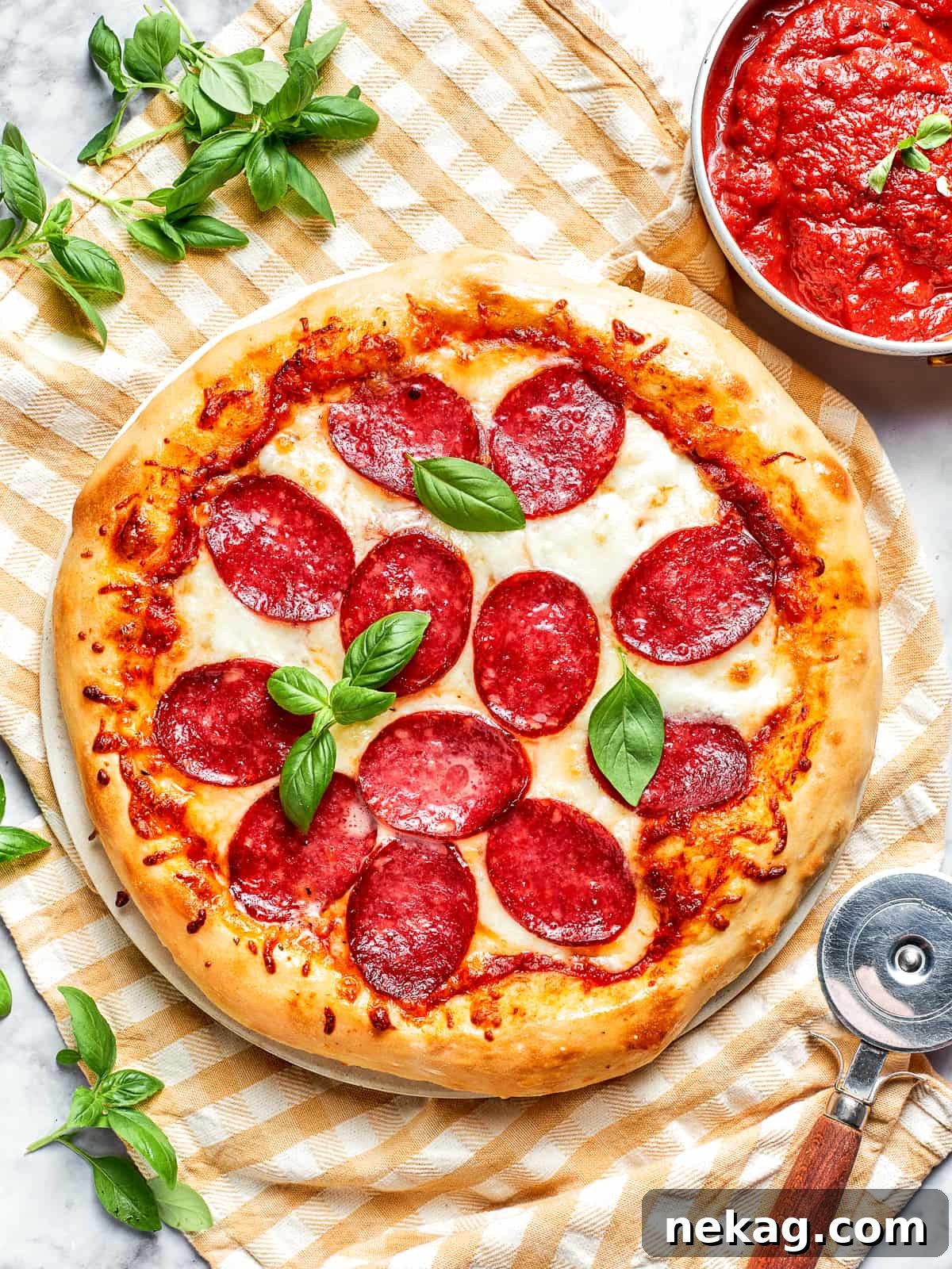 An overhead view of a perfectly baked, complete pizza, featuring a golden crust, bubbling cheese, and perfectly crisped pepperoni.