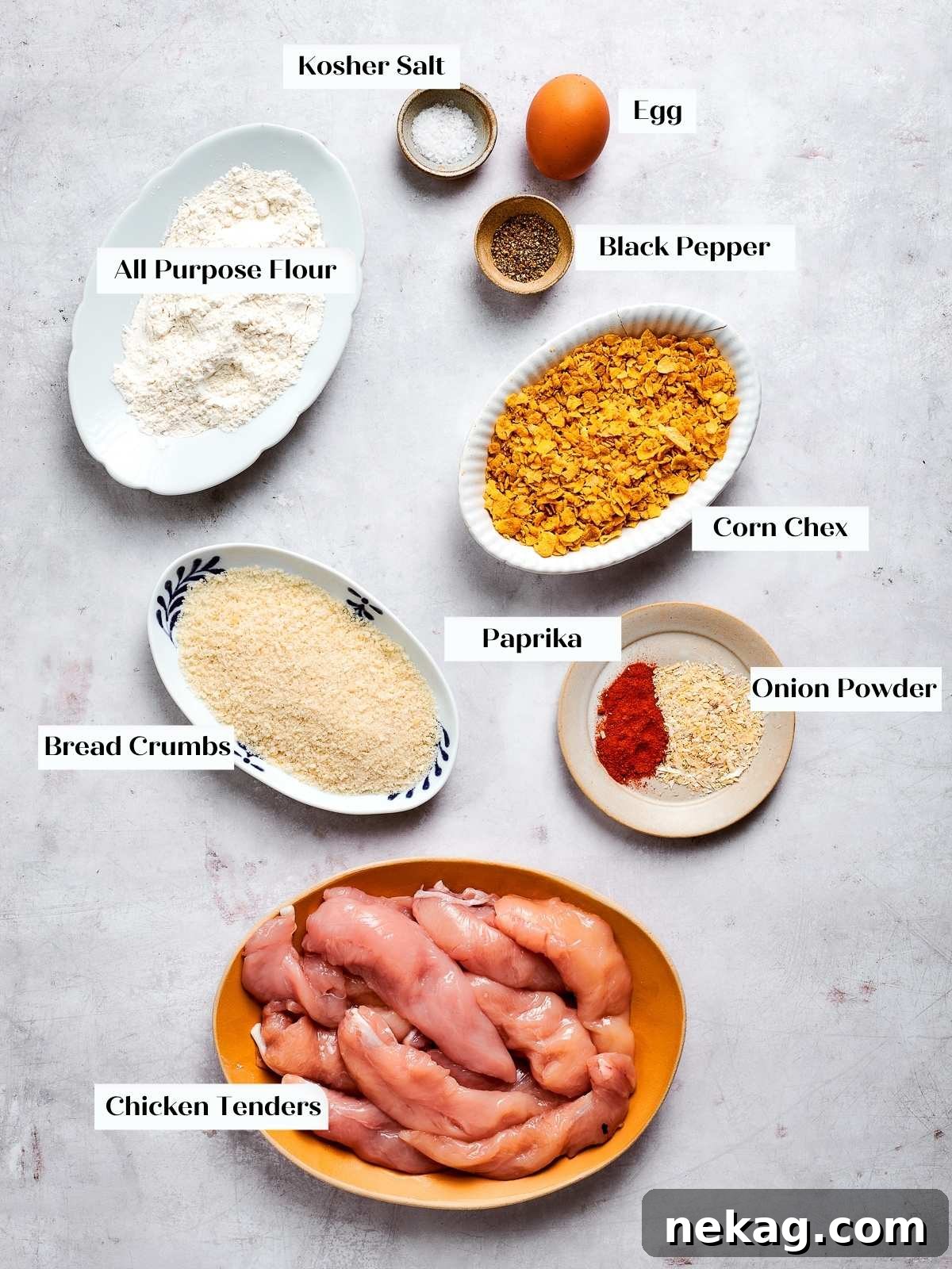 Crispy Air-Fried Chicken Fingers 4 All ingredients for air fryer chicken tenders laid out on countertop for prep.