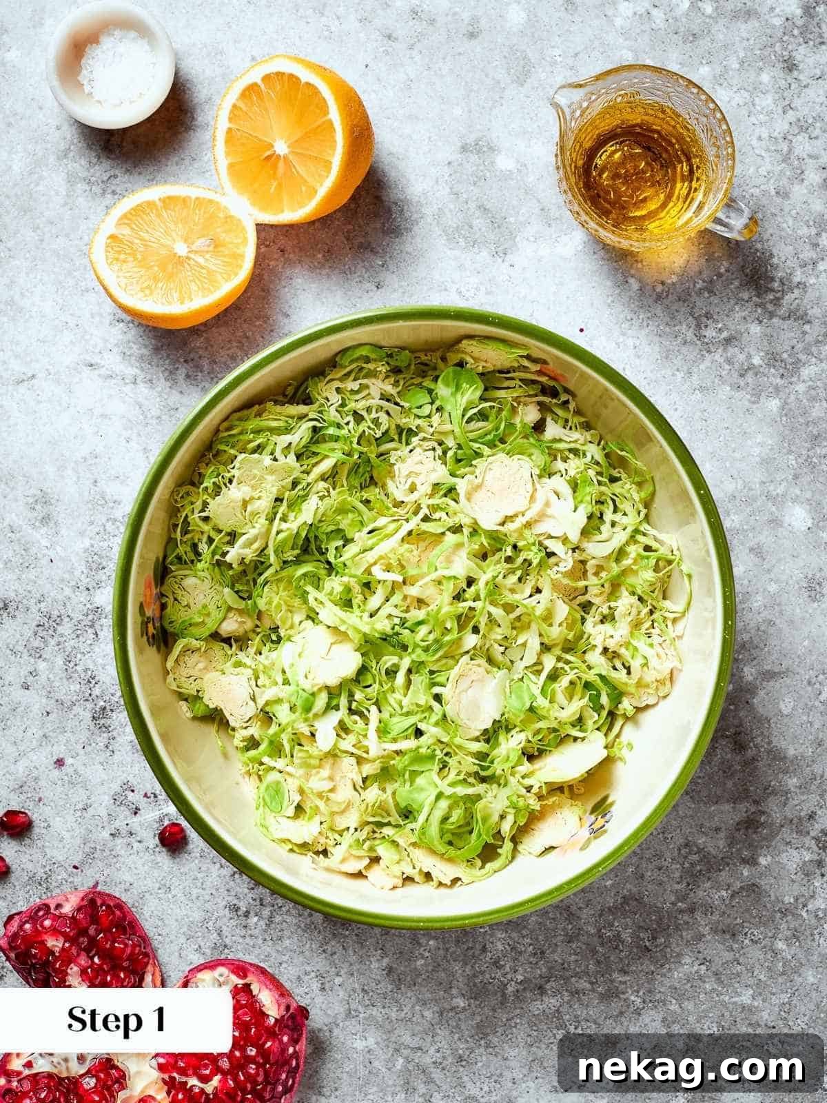 Freshly prepped raw Brussels sprouts for salad, thinly trimmed and shaved into delicate ribbons, gathered in a mixing bowl.