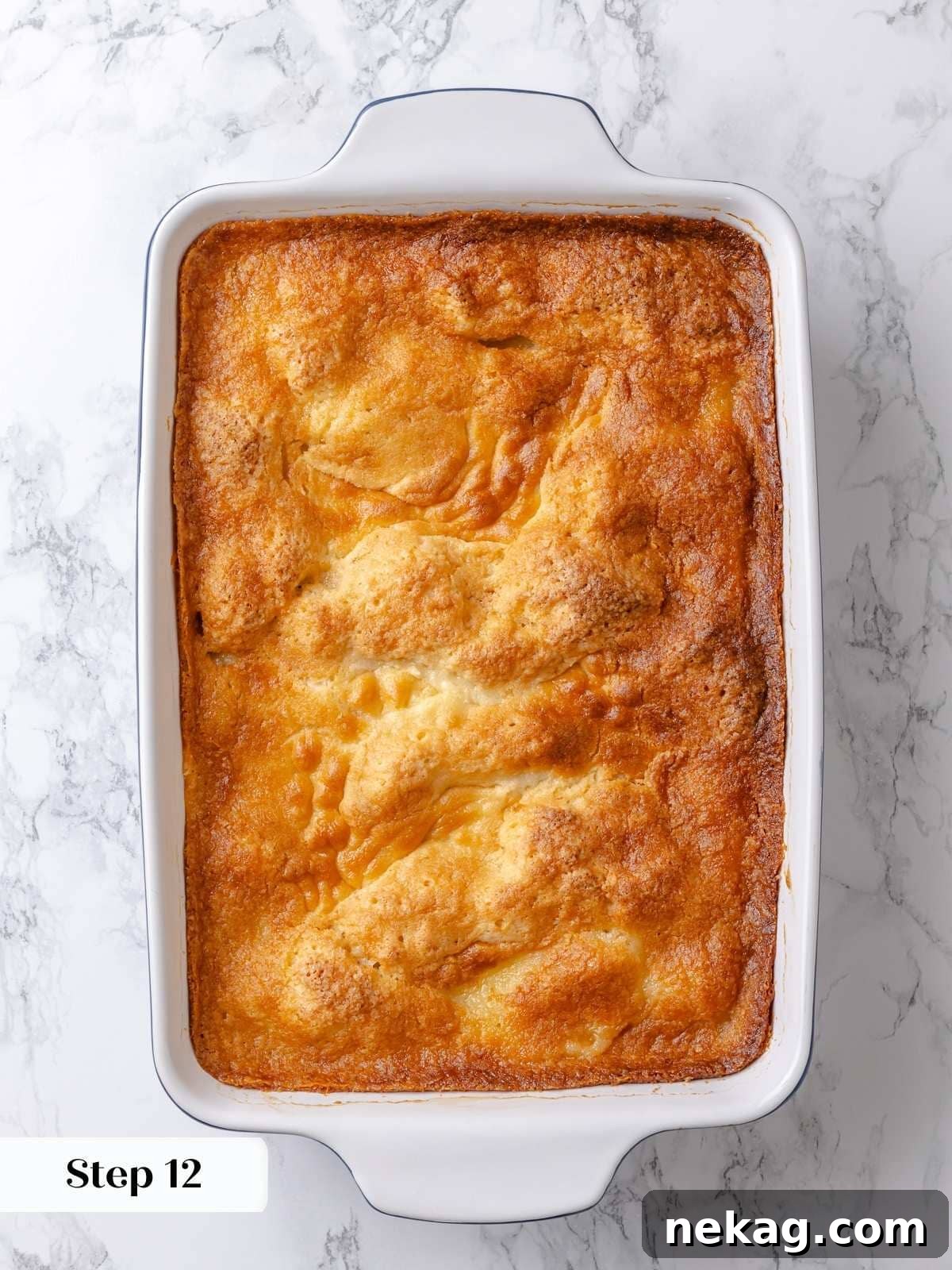 Finished gooey butter cake baked to a beautiful golden brown with perfectly puffed edges and a soft, inviting center.