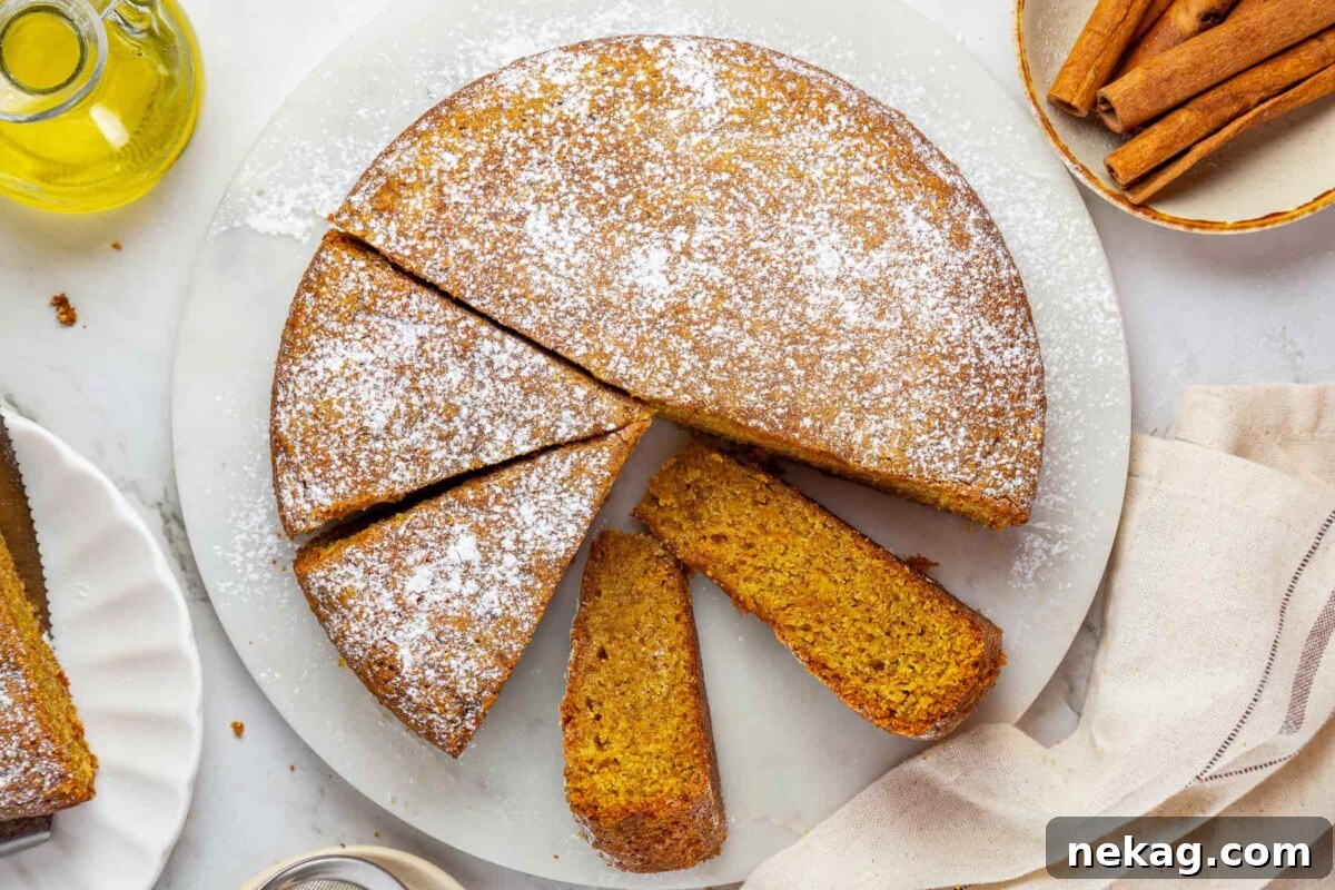 Mediterranean Pumpkin Delight 4 A perfectly moist pumpkin cake, expertly sliced to showcase its tender, inviting interior and the balanced blend of warm fall spices throughout.