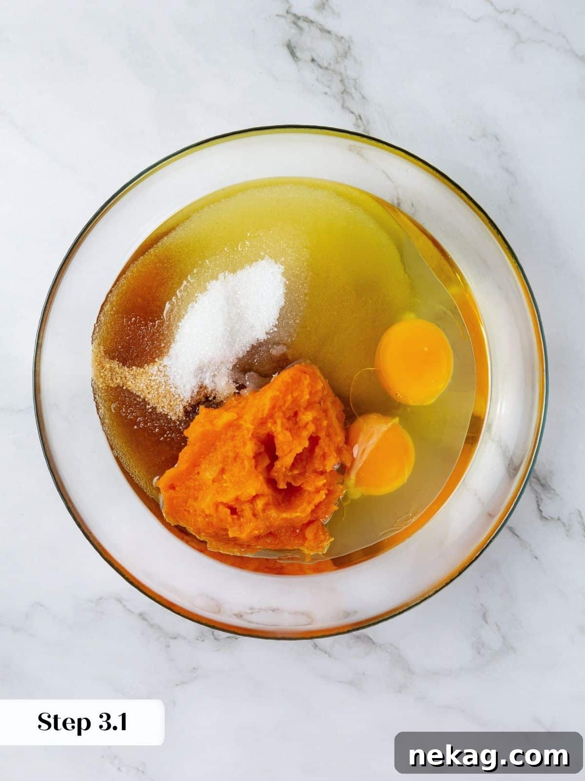 Mediterranean Pumpkin Delight 6 Olive oil, pumpkin puree, granulated sugar, light brown sugar, and eggs are freshly added to a large mixing bowl, awaiting a thorough whisking to combine into a smooth wet mixture.