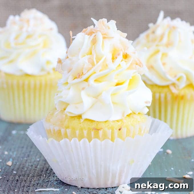 Lemon & Coconut Cloud Cupcakes 4 A close-up shot of the cupcake's texture, revealing the moist crumb and hints of coconut.
