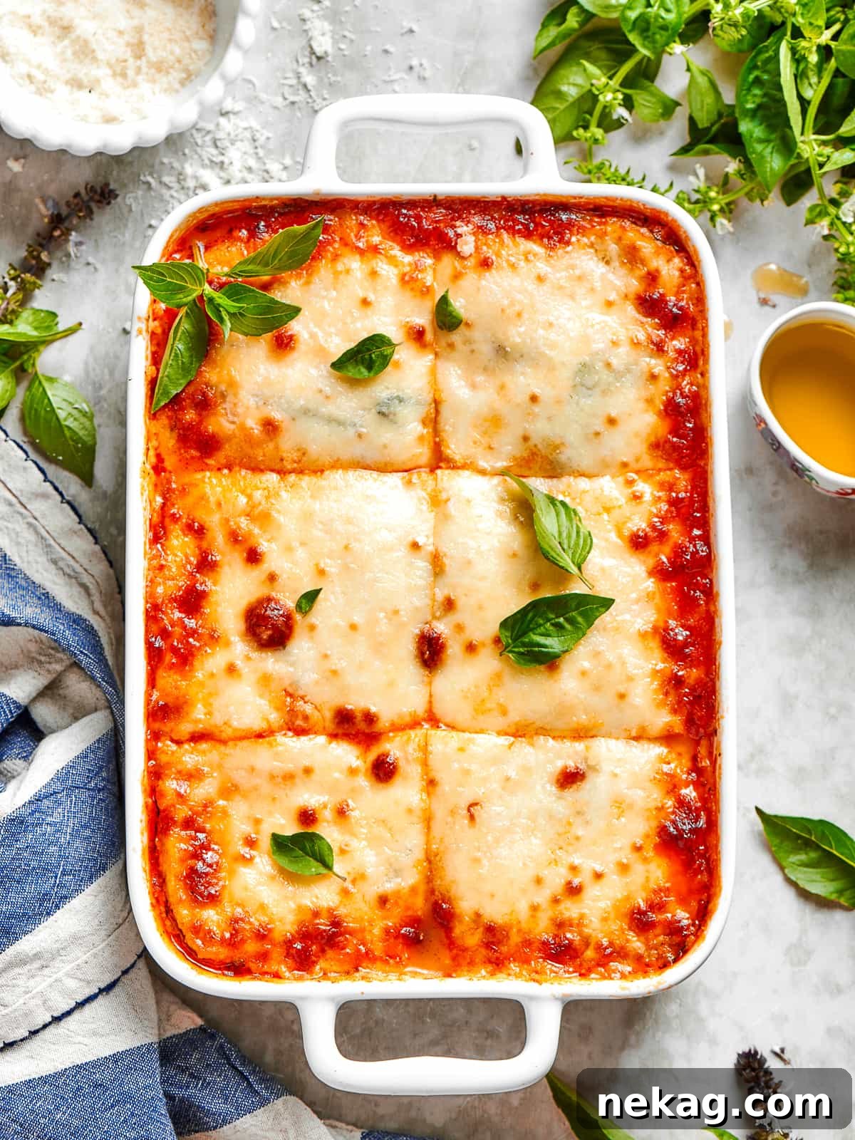 The finished Zucchini Lasagna, neatly sliced into squares, beautifully reveals its clean, distinct layers and perfectly melted, golden-brown cheese on top.