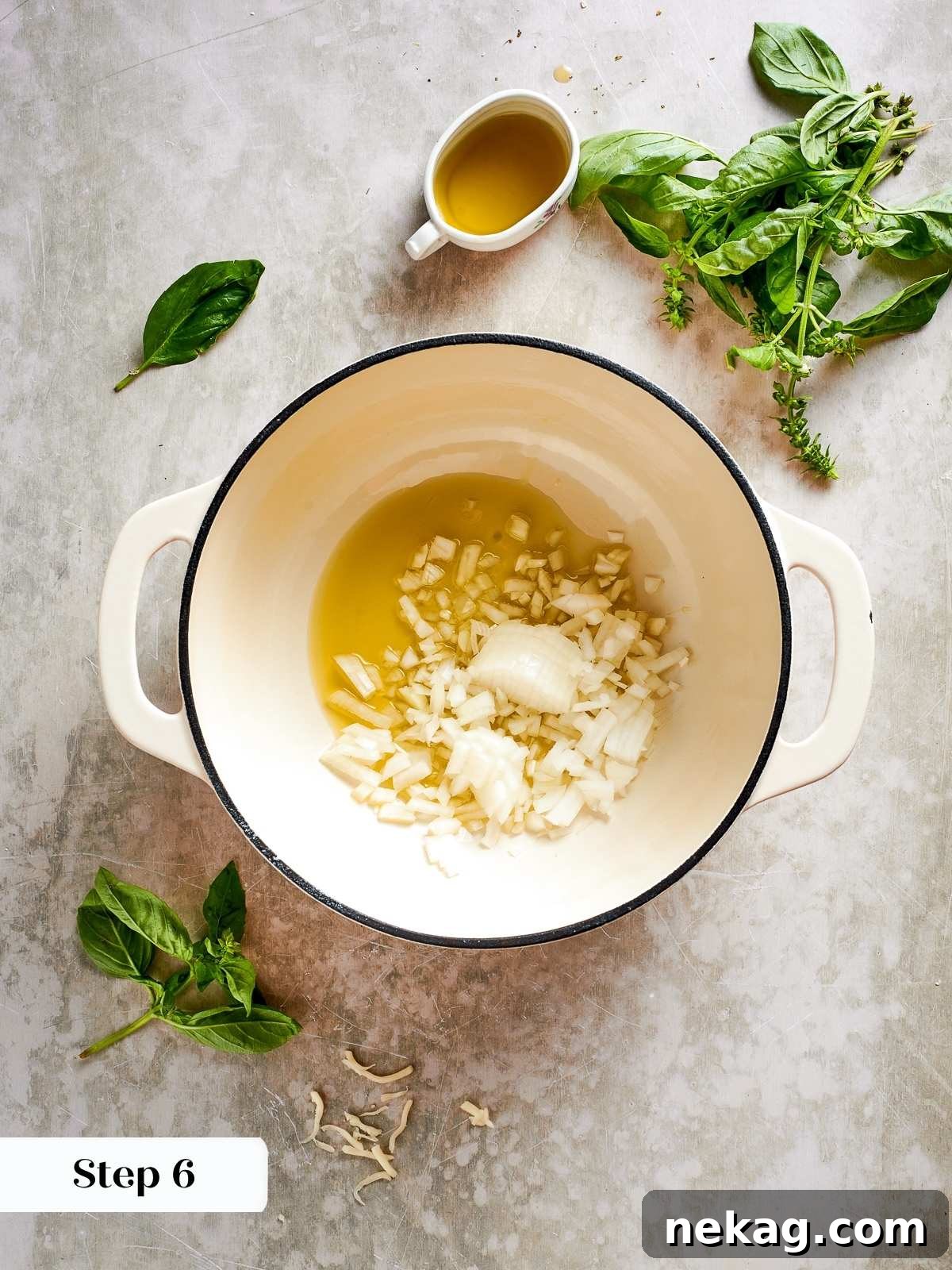 Finely diced onions and minced garlic are gently sizzling in hot olive oil within a skillet, creating a fragrant and foundational flavor base for the lasagna sauce.