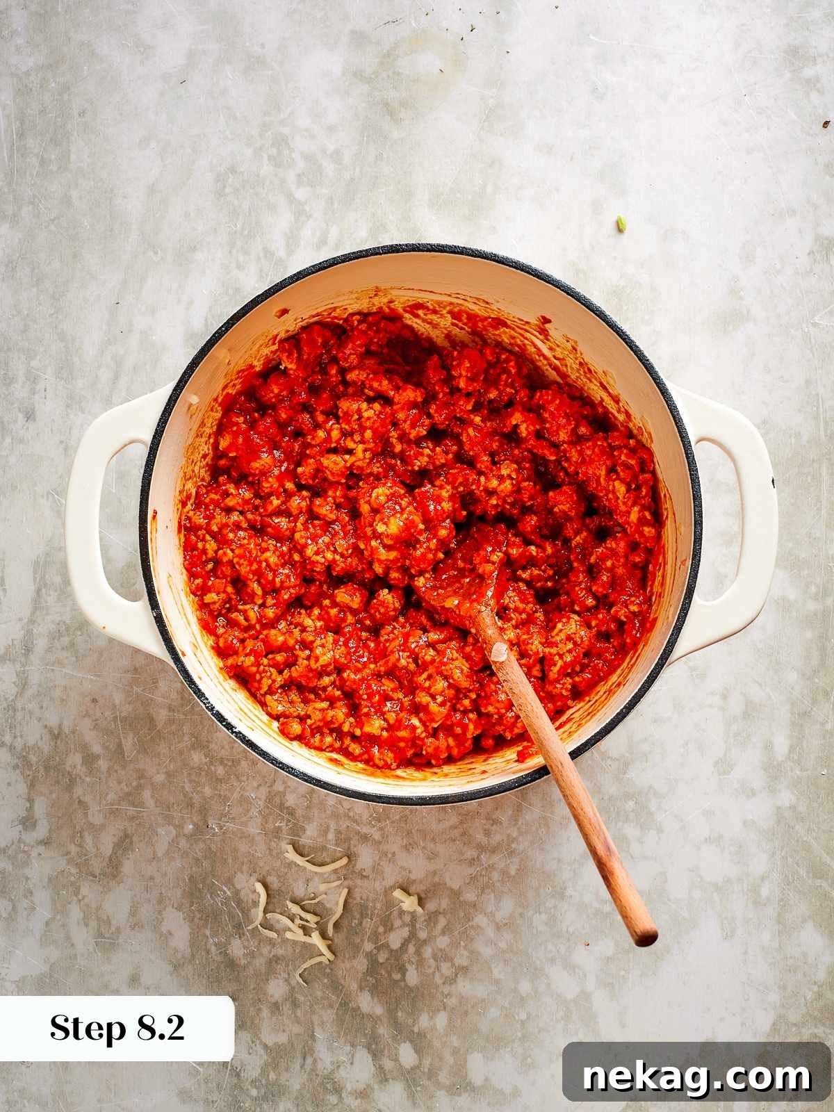 The thickened chicken tomato sauce, simmered to a rich, cohesive texture, perfect for layering without making the lasagna watery.