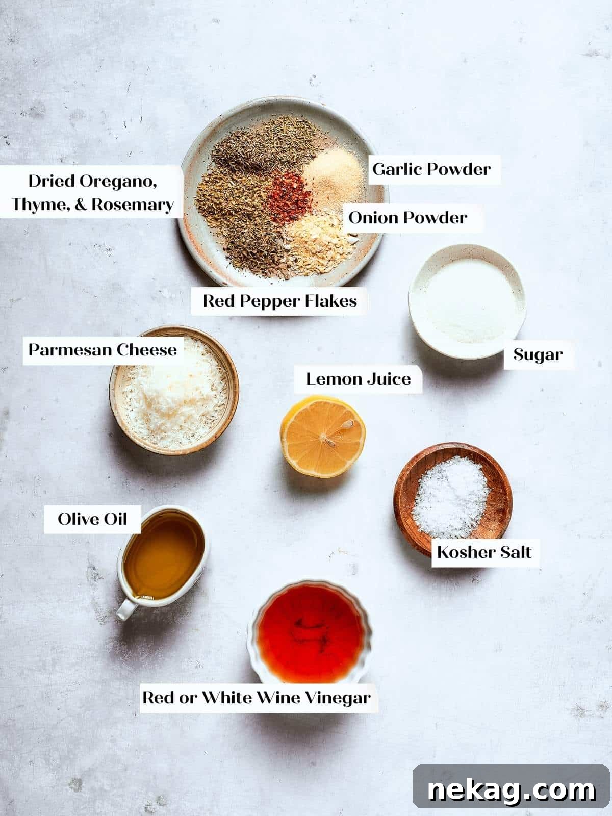 Zesty Homemade Italian Dressing 3 Ingredients for Italian salad dressing arranged on a countertop, including olive oil, vinegar, and various spices.