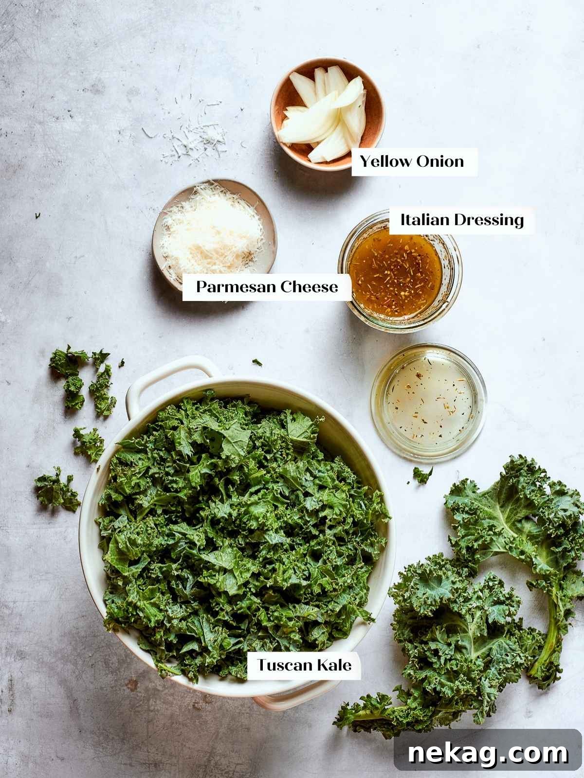 Tuscan kale salad ingredients prepped on a kitchen counter, ready to assemble into a fresh salad.