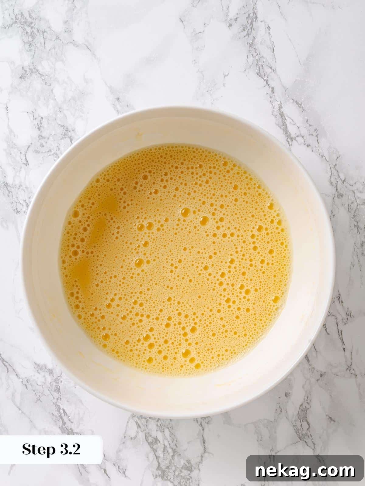 Golden Maple Delight 7 Oil thoroughly whisked into eggs until smooth, creating a perfect emulsion for the maple cake batter.