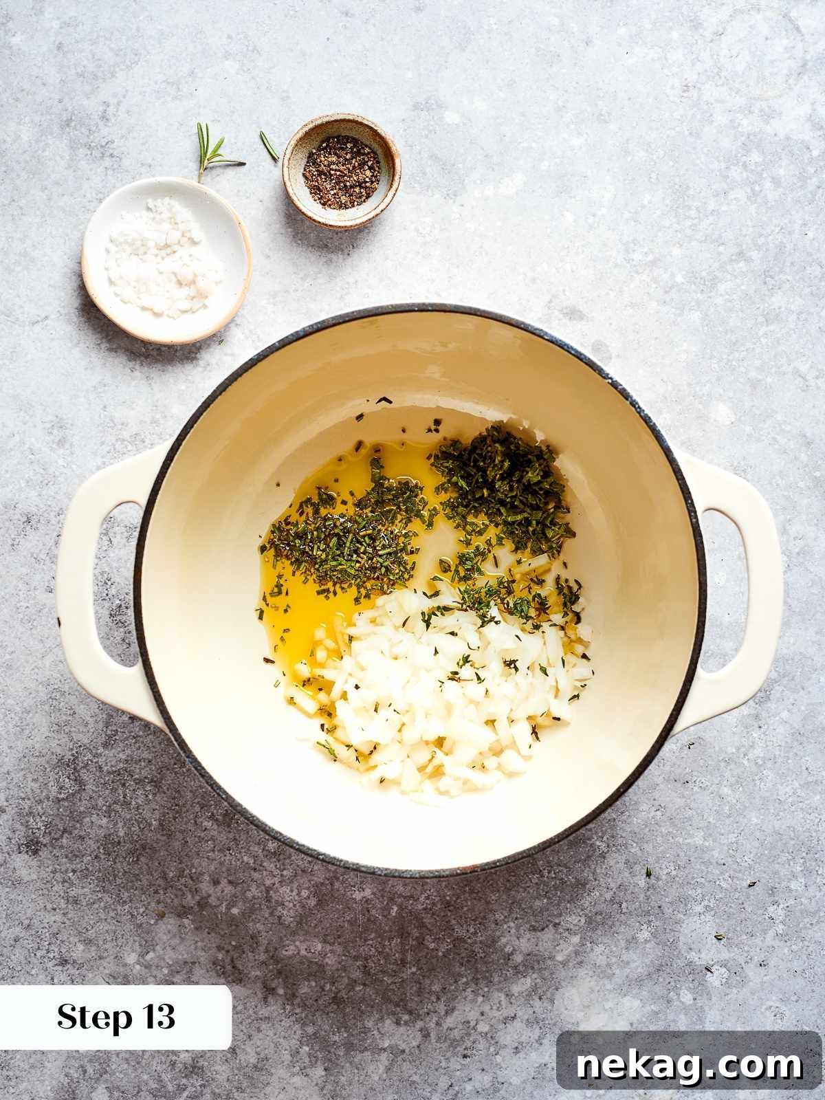 Finely chopped onions and fresh herb sprigs gently sautéing in shimmering olive oil at the bottom of a heavy-bottomed soup pot, releasing their aromatic flavors.