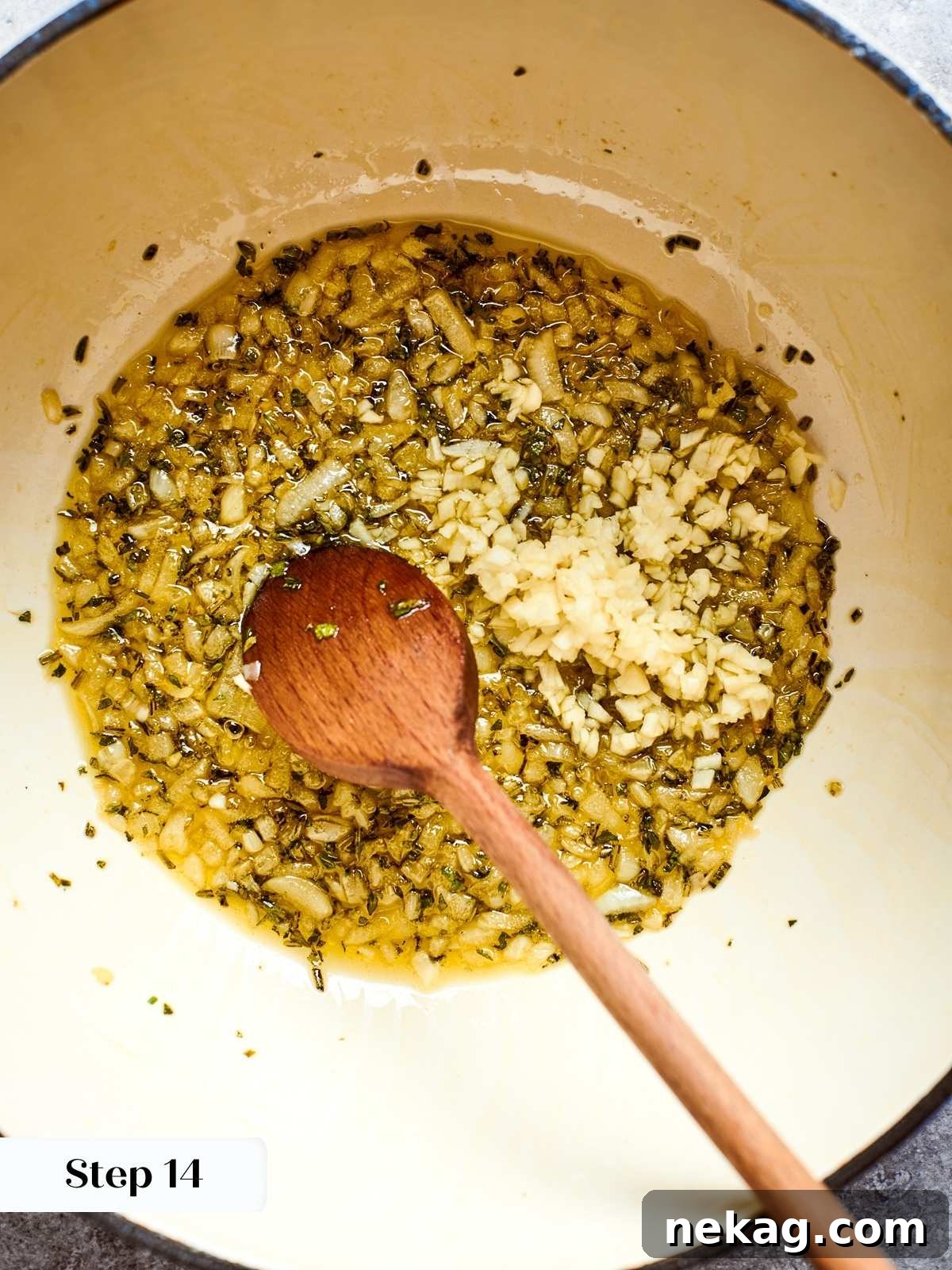 Freshly minced garlic cloves added to the transparent, sautéed onions and herbs in the soup pot, infusing the base with its pungent aroma.
