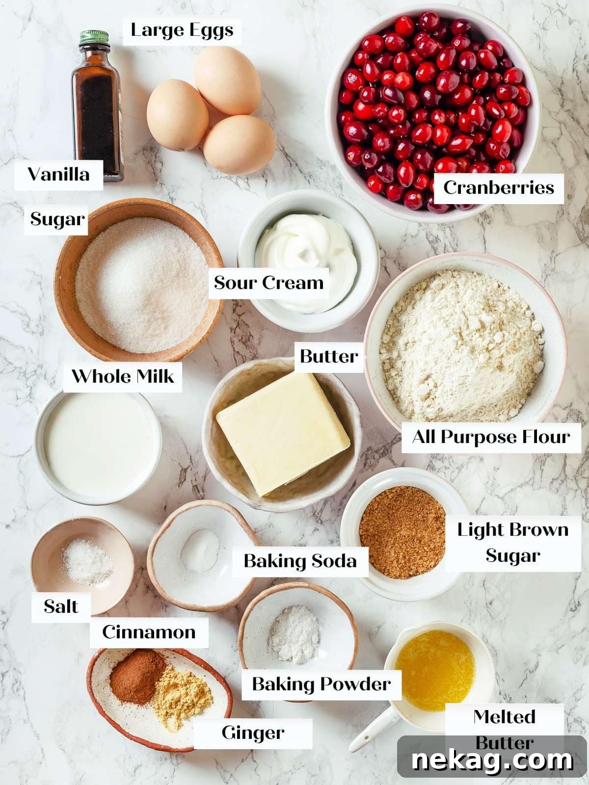 Jeweled Cranberry Cake 3 Precisely measured cranberry cake ingredients neatly arranged on a pristine white countertop, poised for the baking process.