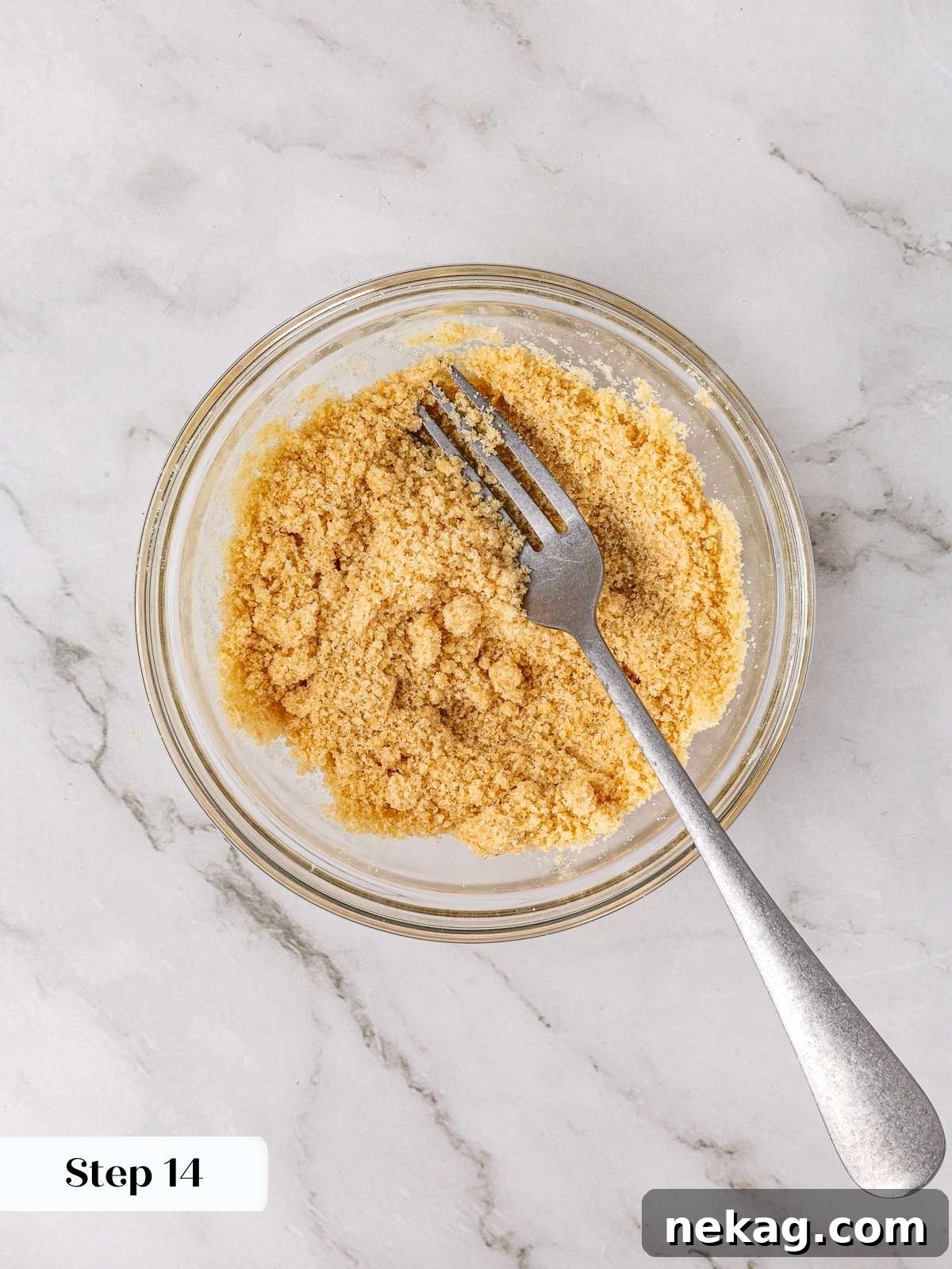 Apple Crumble Cookies 12 Brown sugar crumble mixture forming in a clear bowl after being stirred with melted butter.