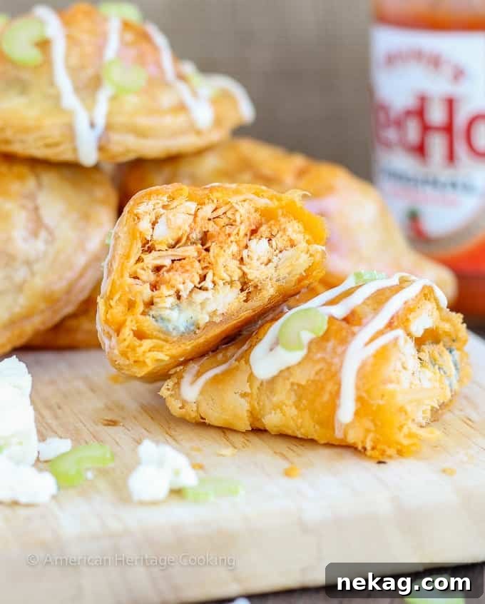 Spicy Buffalo Chicken Blue Cheese Hand Pies 4 A plate of freshly baked Buffalo Chicken Blue Cheese Hand Pies, ready to be served at a gathering.