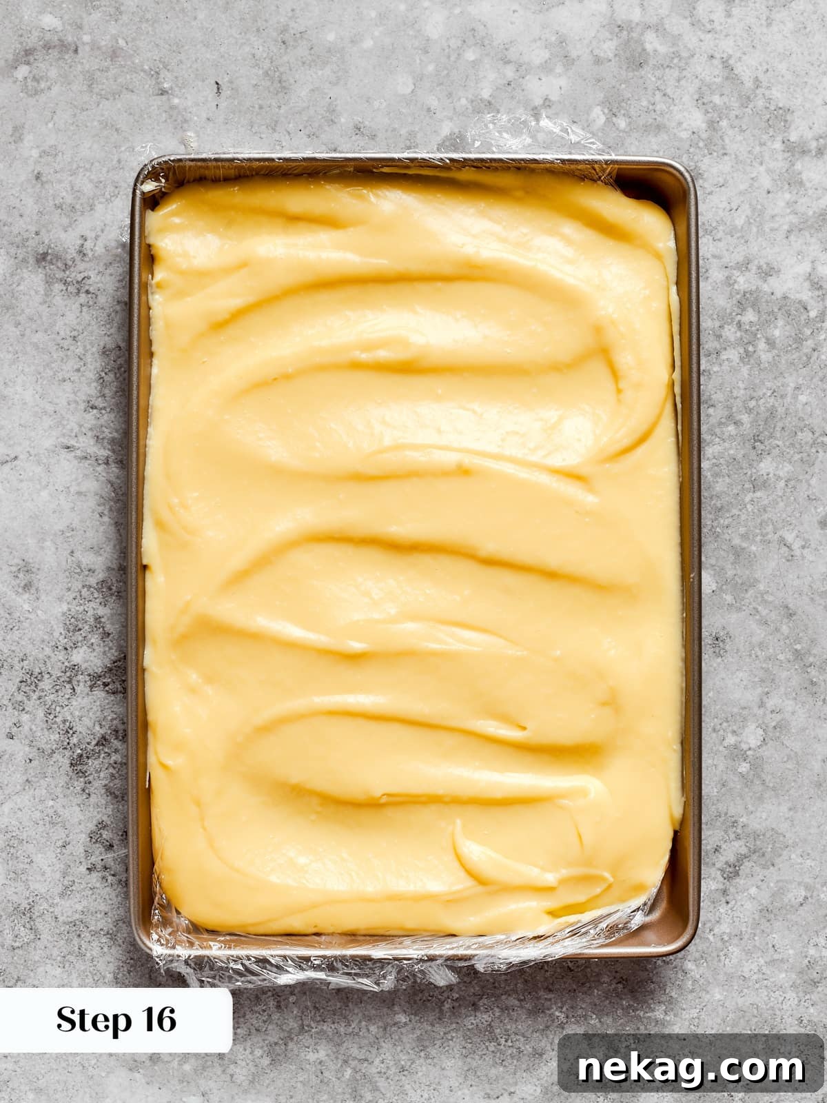 Delicate Layered Crepe Dessert 13 Warm custard leveled on a sheet so it can chill and firm for later use.