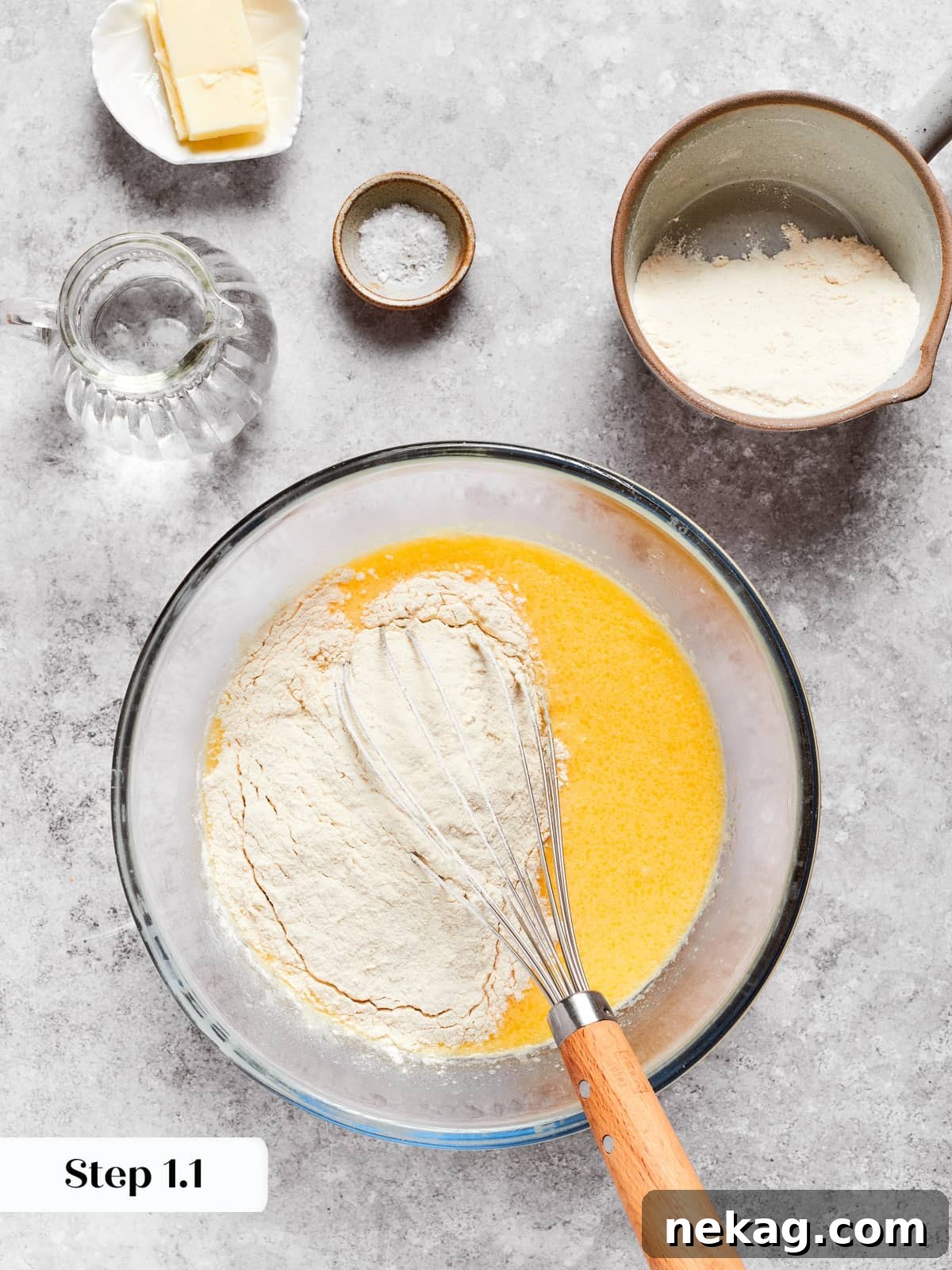 Delicate Layered Crepe Dessert 6 Ingredients being mixed in a bowl to create the base batter for thin cake crepes.