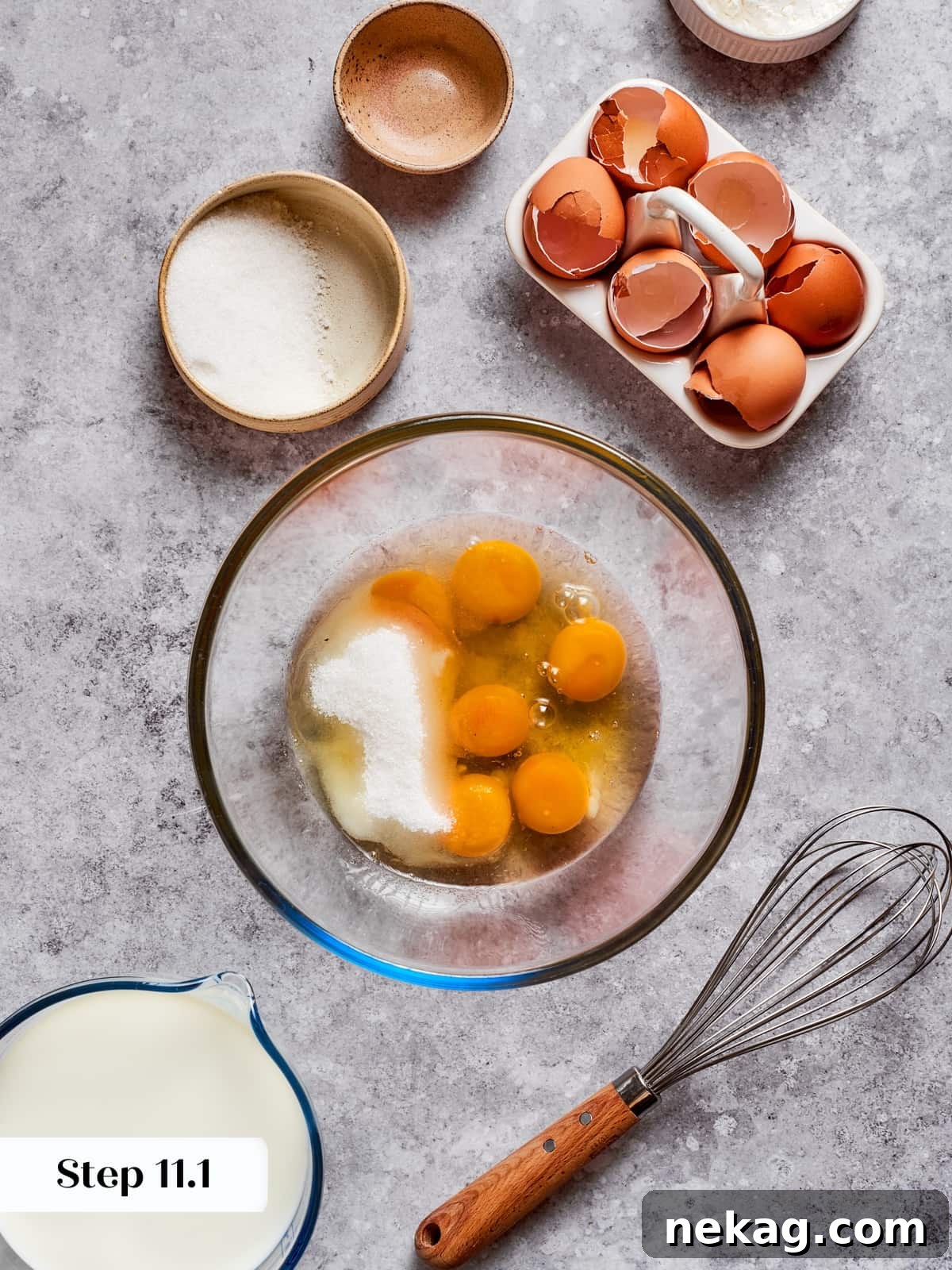Delicate Layered Crepe Dessert 10 Ingredients for the pastry cream being whisked into a smooth mixture in a bowl.