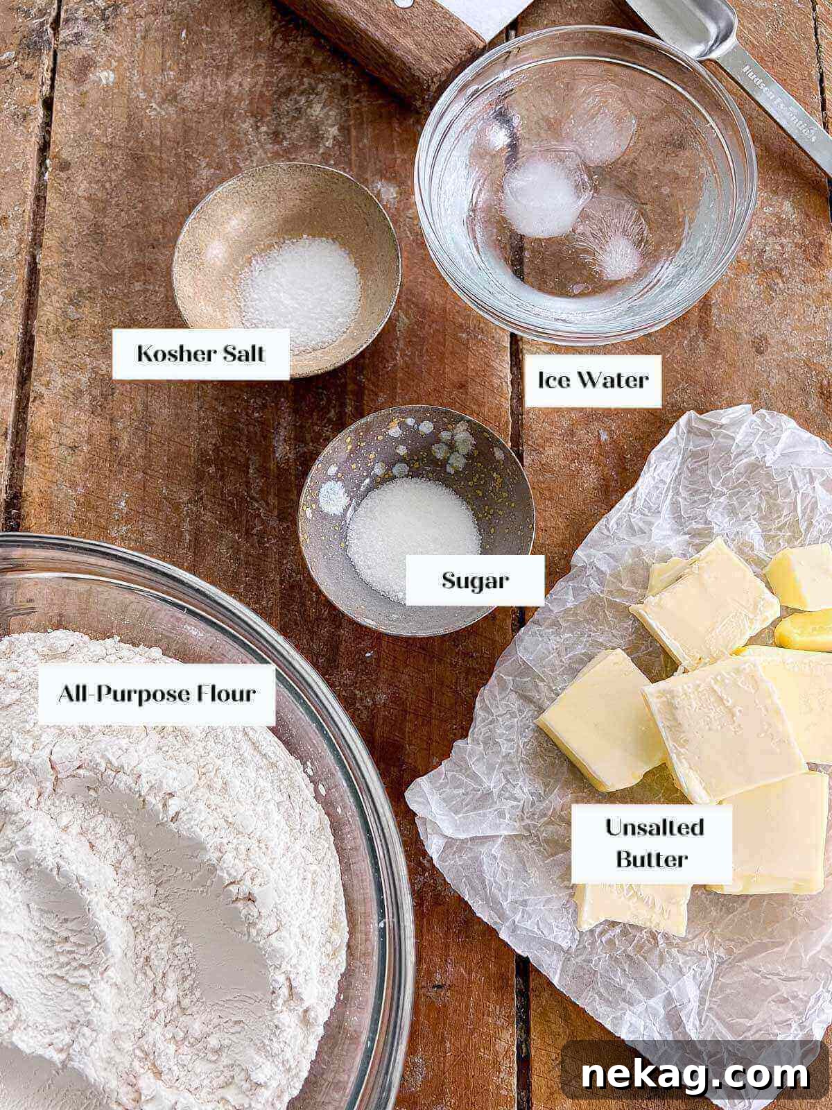 Flaky Butter Crust Perfection 3 Ingredients for all-butter pie crust laid out on a wooden board.