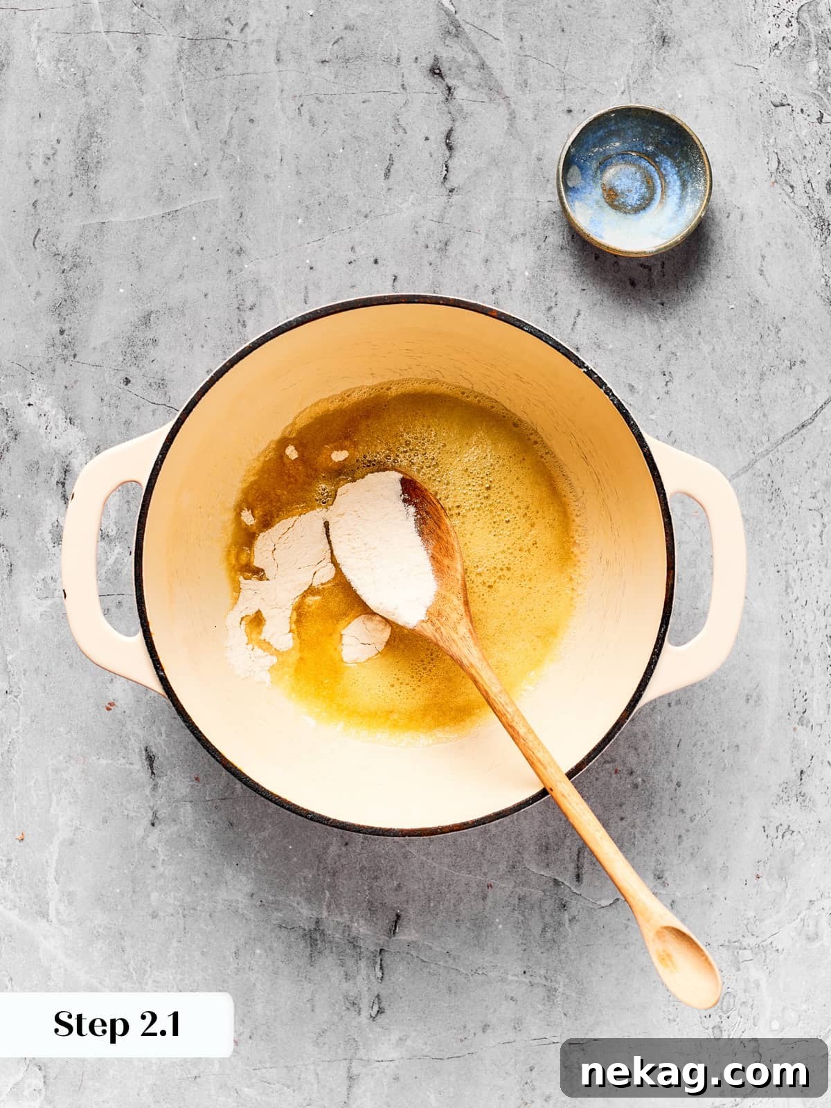Melted butter and flour combined in saucepan to begin cheese sauce base.