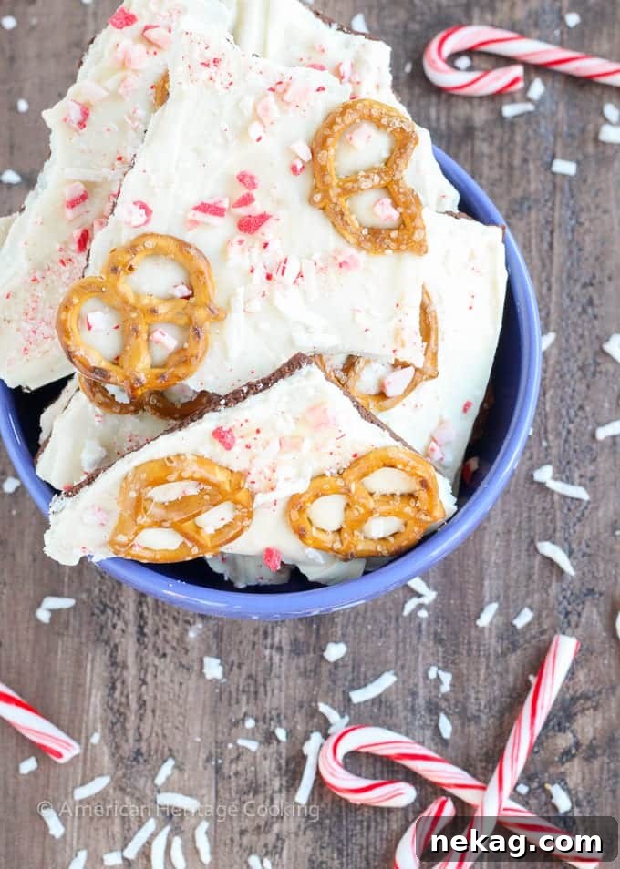 This easy Coconut Peppermint Pretzel Bark is a minty mix of white and dark chocolate with candy cane "snow", salty pretzels and a hint of coconut! You will love the holiday mint flavor! 