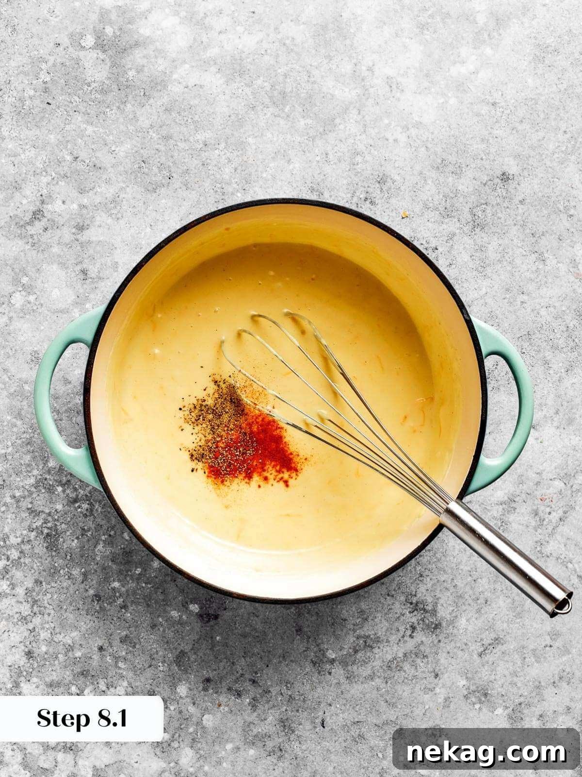 Ultimate Baked Mac and Cheese 12 Vibrant paprika and aromatic dry mustard being sprinkled into a gently bubbling roux, infusing the sauce with warmth and depth.
