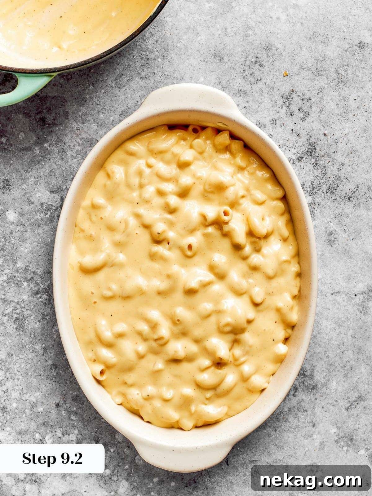 Ultimate Baked Mac and Cheese 15 Elbow macaroni, drenched in creamy cheese sauce, settled into a baking dish, ready for its final baking step to achieve golden perfection.