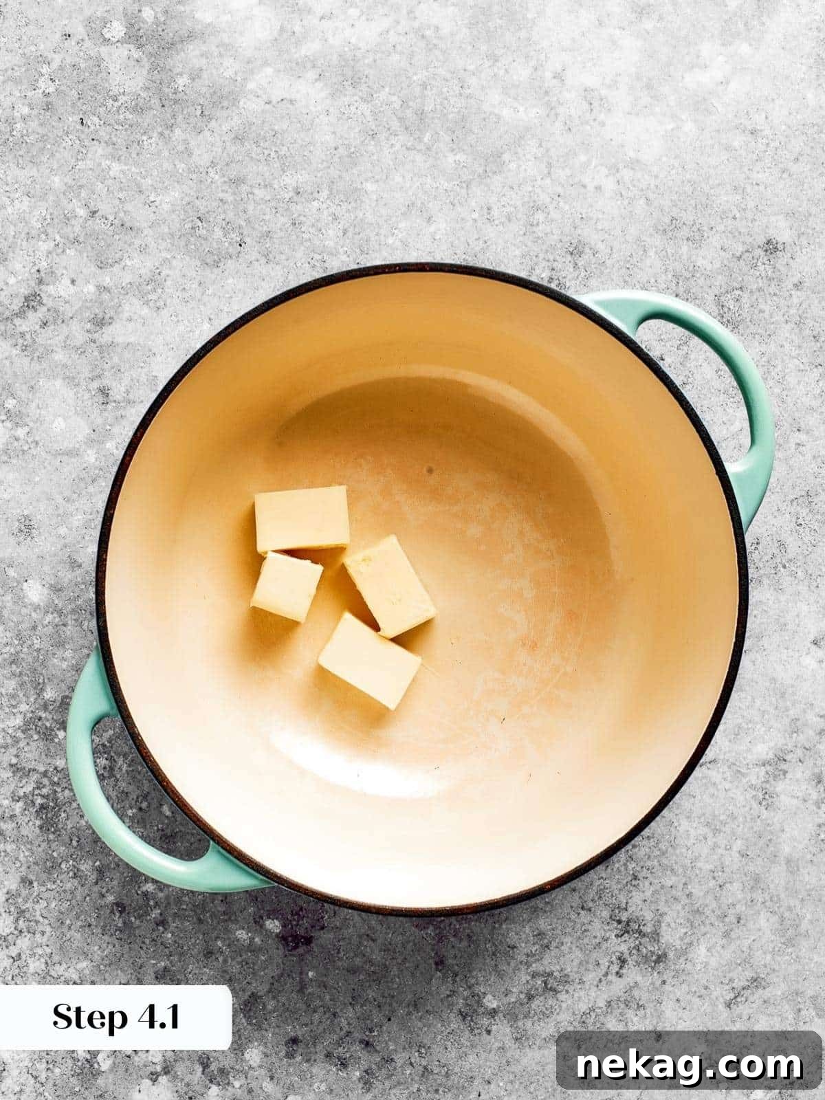 Ultimate Baked Mac and Cheese 6 Golden butter melting in a saucepan, the first step to creating a rich and creamy roux for mac and cheese.
