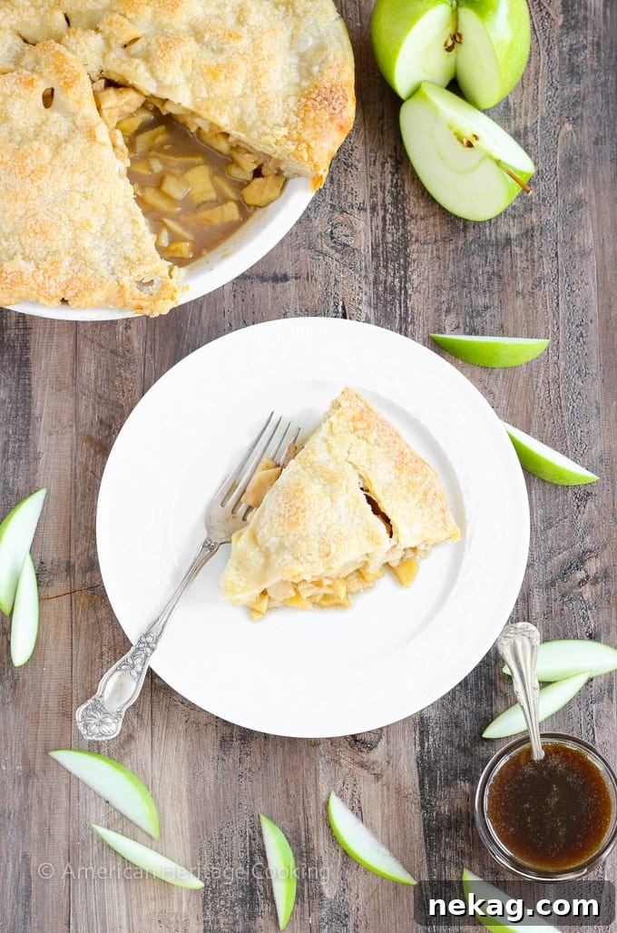 Close-up shot of a baked Apple Butterscotch Pie, showcasing its rich, bubbly filling and golden crust.