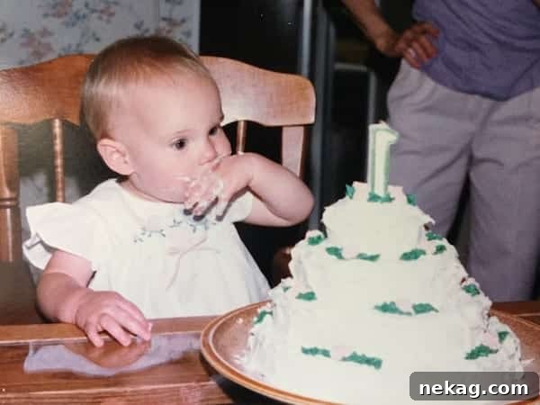 A childhood photo of the author as a baby with a chocolate cake, showing early love for chocolate.