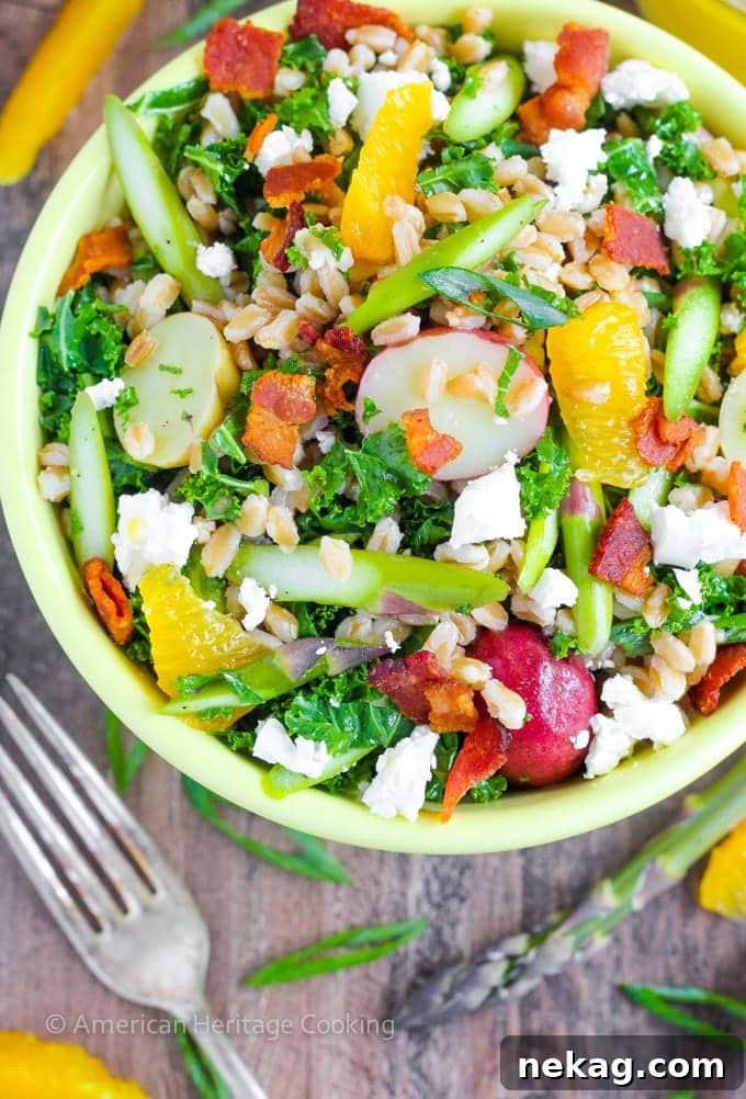 Orange-Kissed Asparagus Farro Salad for Spring 4 A beautifully composed bowl of Asparagus Orange Farro Salad, garnished with fresh herbs and citrus segments.