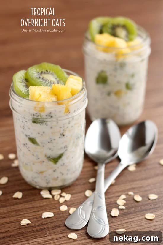 Paradise Overnight Oats 2 A refreshing jar of Tropical Overnight Oats, topped with vibrant kiwi and pineapple chunks, ready for a healthy breakfast.