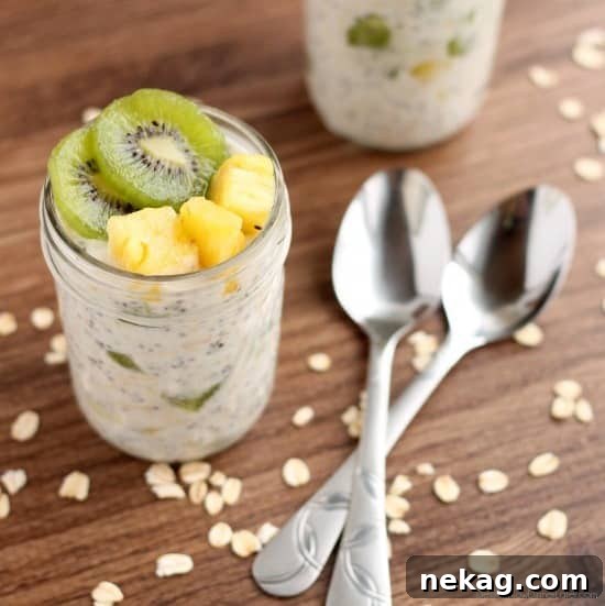 Paradise Overnight Oats 4 Mason jars filled with Tropical Overnight Oats, ready to be refrigerated.